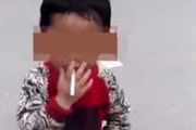 3岁男童叼烟拦车乞讨 父亲嗜烟酒成性拒绝救助[多图]